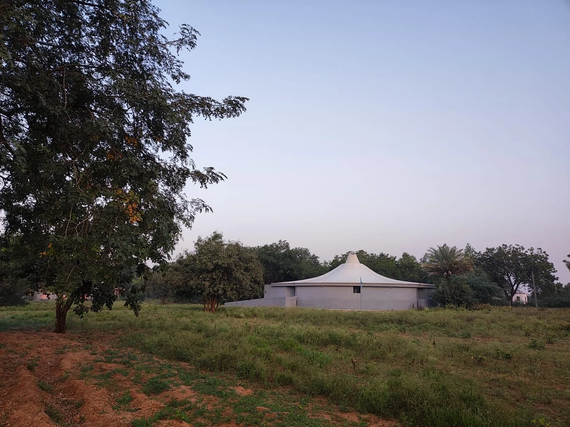 Sri Aurobindo Mahamandir exterior view at Ompuri - Sacred temple architecture representing the Mother's four powers in Gujarat spiritual township