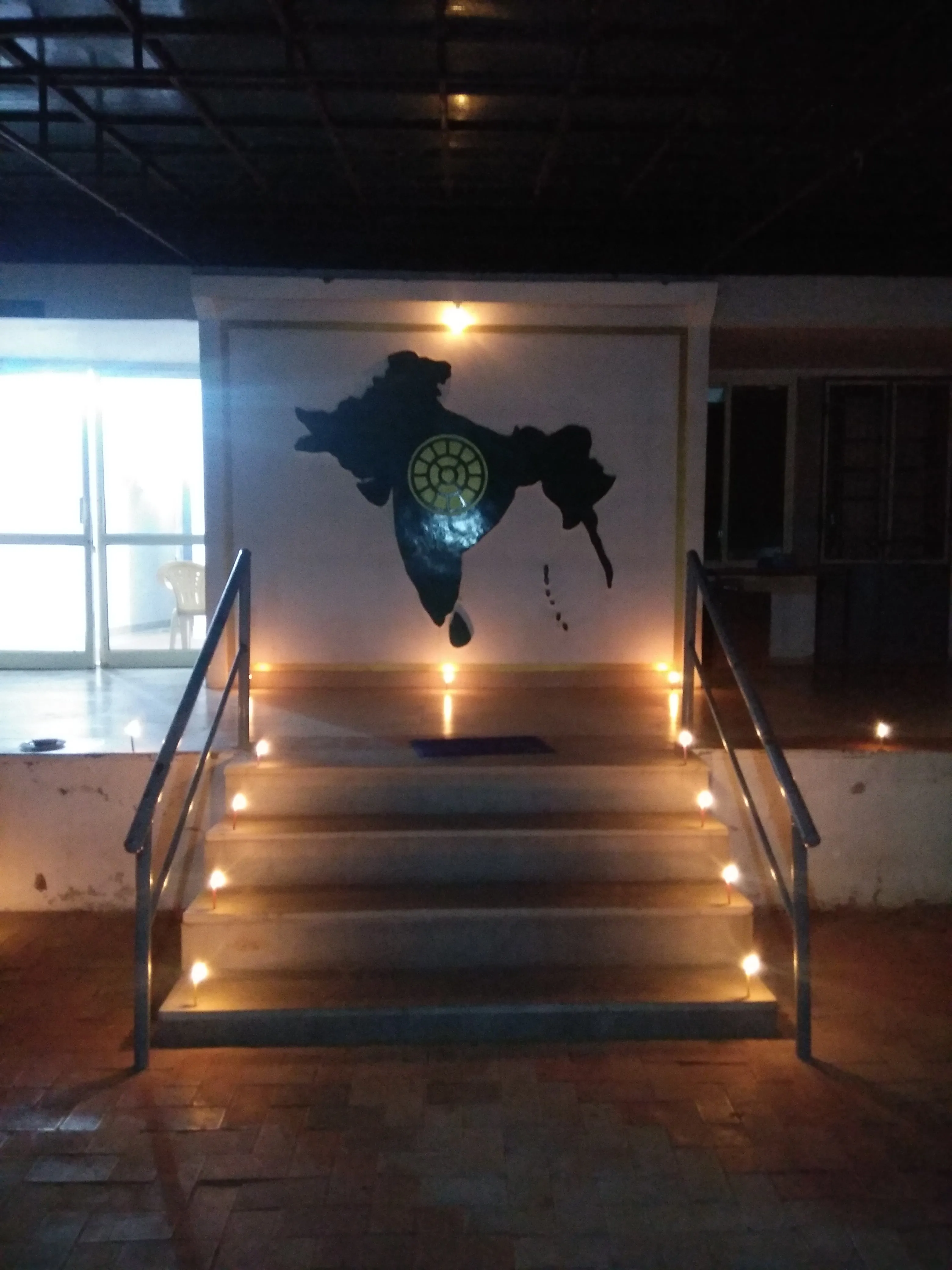 Meditation room with illuminated India map at Mahamandir